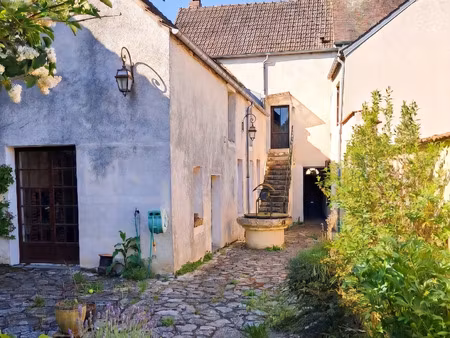 maison comprenant trois logements