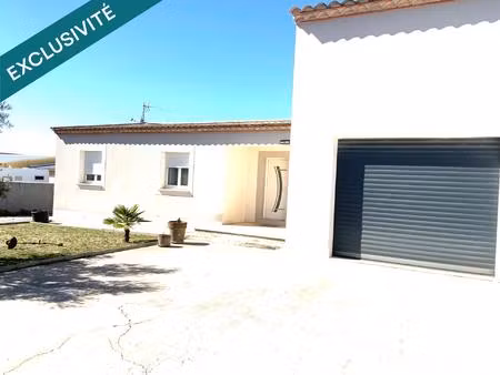 maison t4 de 130m2 sur parcelle de 1124m2 en zone artisanale avec hangar attenant .