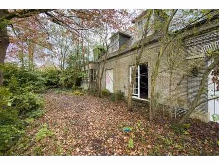 lot 1 : une maison d’habitation avec terrains