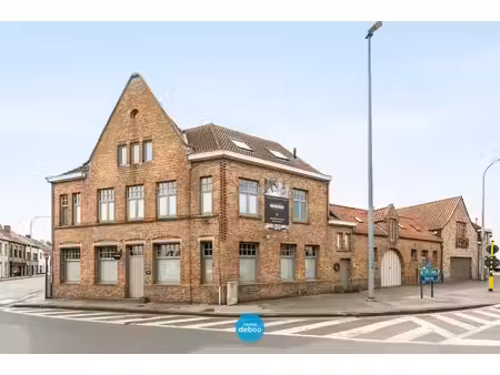 uitzonderlijk ruime polyvalente woning met zuidgerichte tuin