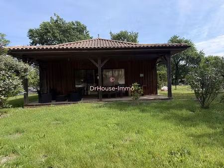maison ossature bois avec dépendance dans un environnement calme.