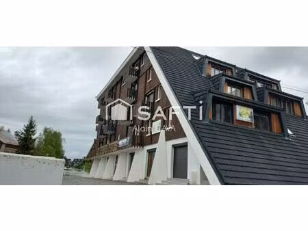 studio de 35m² avec casier à ski  local commun et parking privé