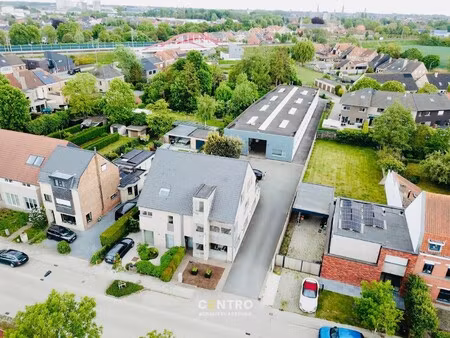 strategisch gelegen bedrijfspand met magazijn  kantoren  verhuurd appartement & perceel gr