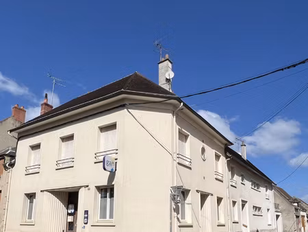 ensemble immobilier de deux maisons de villes avec commerce