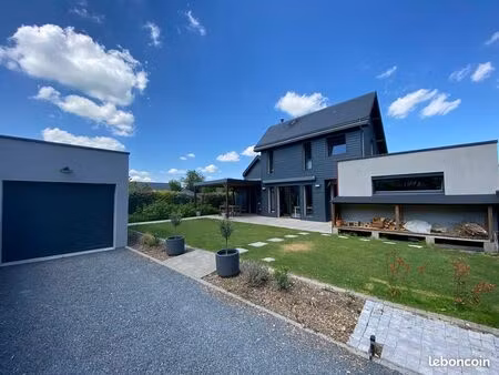 maison contemporaine avec jardin  terrasse  pergola et garage à montigny 76380