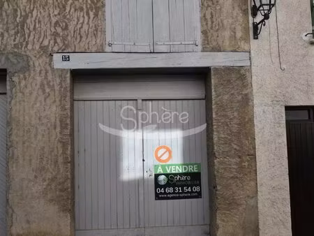 garage avec pièce sur le dessus