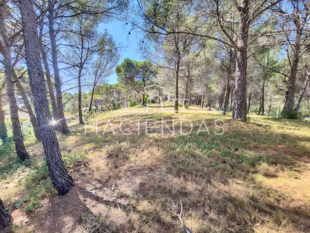 terrain au calme  dans un environnement naturel à pied des commerces
