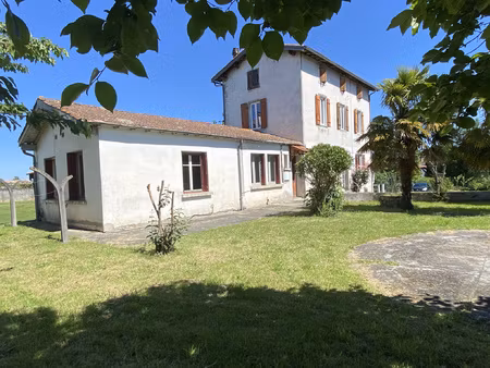 maison de village avec grand garage et terrain constructible