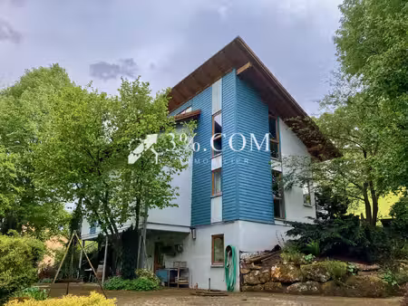 maison ossature bois avec grand terrain paysager