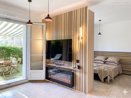 grand studio   esprit f2 34 m2 jardin  parking  cave