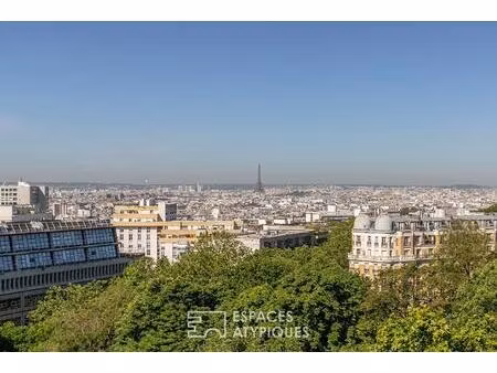 appartement suspendu sur le parc des buttes-chaumont et la skyline parisienne