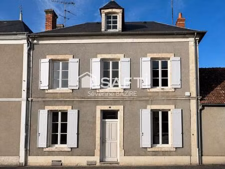 maison de caractère avec cour  garage et potentiel d’aménagement