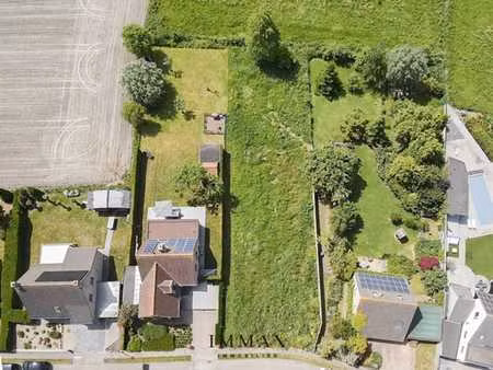 terrain à bâtir avec prairie/terrain agricole attenant