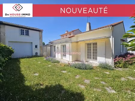maison de 145 m² avec 4 chambres et 2 garages.