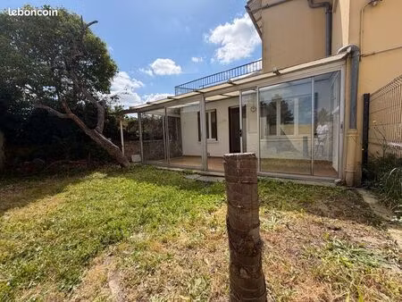 t3 de 70 m² avec jardinet & véranda