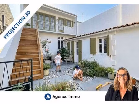 maison duplex avec un local pro loué et garages