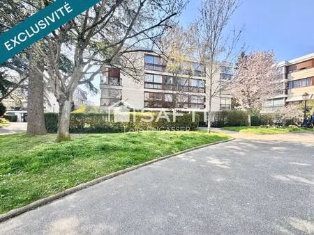 appartement en rez-de-jardin - place de parking et cave