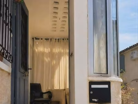 maison de village avec terrasse  véranda  caves  garage et stationnement.