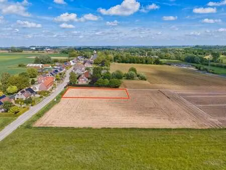 terrain à bâtir de 12 ares 45 ca avec 24 mètres de façade