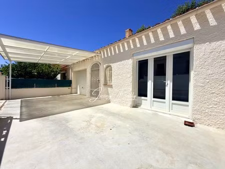 maison de plain-pied 2 faces  2 chambres avec garage sur terrain de 200 m²