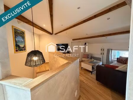 duplex de caractère avec garage à deux pas du centre ville .
