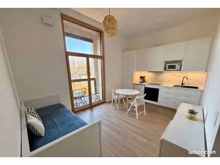 studio meublé neuf 29m² · loggia vue seine · rooftop panoramique · ligne 13 & 14