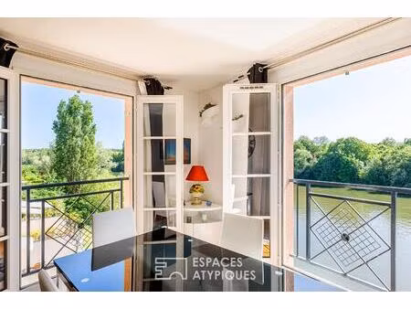 douceur de vivre à cergy port : un appartement sur l'eau