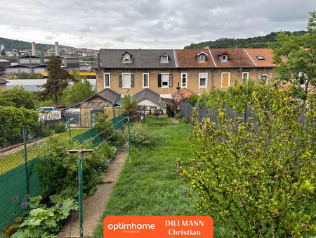 maison jumelée avec garage et jardin