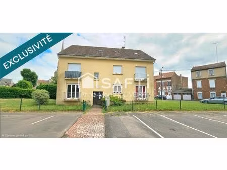 immeuble en monopropriété offrant un bon rapport : avec 5 lots  garages  caves  jardin  st