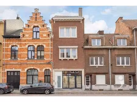 opbrengsteigendom met handelspand  studio en 6 studentenkame