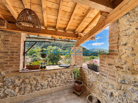 a proximité de gagnières au calme maison de village en pierr