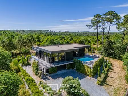 propriété d'architecte confidentielle en lisière de forêt du golf