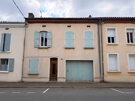 maison de ville avec garage  jardin et locataire en place