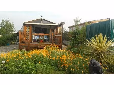 mobil home avec garage sur terrain proche du lac