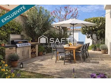 maison 3 faces avec jardin et cabanon