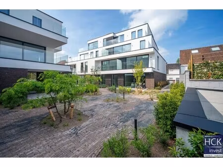 kruishoutem - zongericht nieuwbouw app. met 2 slpk. en 2 terrassen!