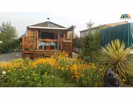 mobil home avec garage sur terrain proche du lac
