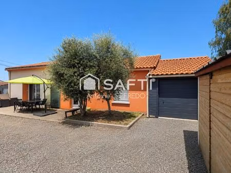 maison rénovée avec poêle et grand garage