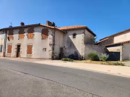 brillac - maison en pierre dans le village avec cour  dépendances et terrain constructible