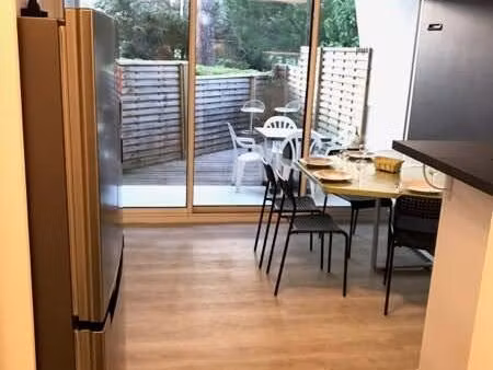 appartement de 2 pièces en rez-de-jardin avec place de parking et cave