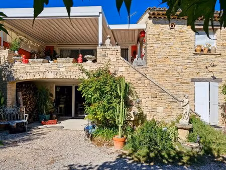 maison doublée en pierres avec son jardin paysager  spa de nage et son pigeonnier