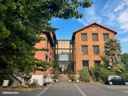 loft 123 m² dans une ancienne usine de 1900 — triple exposition  3 50 m sous plafond  park