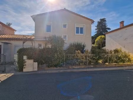maison rénovée avec garage et grande terrasse