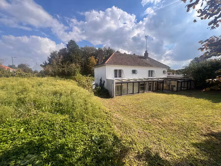 ensemble immobilier : habitation + local professionnel sur 852 m²