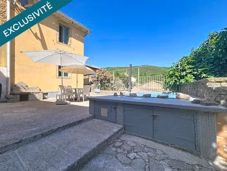 une maison coup de cœur au charme exceptionnel  avec piscine et vue dégagée au cœur des ha