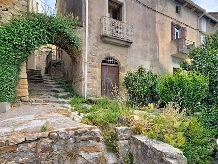 une authentique maison en pierre à réinventer  avec loggia panoramique et vue dominante au