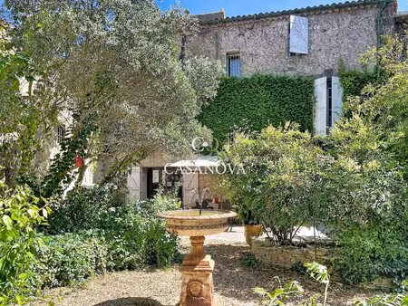 aux abords de pezenas  derrière ses murs de pierre  se dévoile une propriété de caractère.