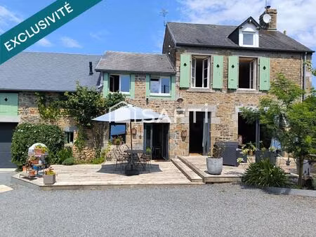 maison en pierre rénovée avec son grand garage