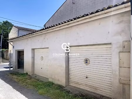 vente de trois garages au centre de saintes