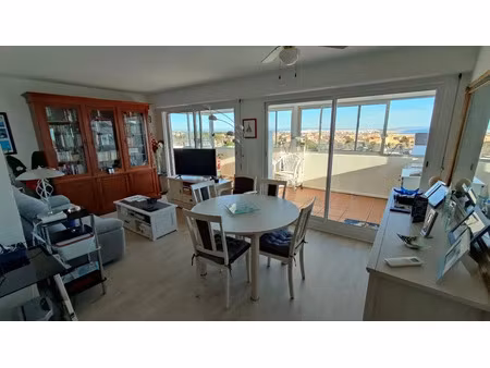 le cap d'agde plage du môle appartement t3 avec véranda vue panoramique avec cellier  gren